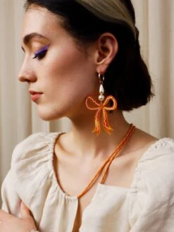 Wolf & Moon Bow Statement Hoops In Cream -Wolf & Moon bow statement hoops apricot model 1 b744674f dd28 40b1 bc59 021483b00c66