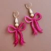 Wolf & Moon Bow Statement Hoops In Magenta 1 Wolf & Moon Bow Statement Hoops In Magenta -Wolf & Moon bow statement hoops magenta lifestyle 1