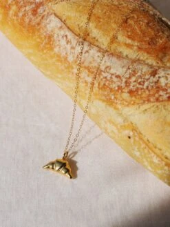 Wolf & Moon Croissant Necklace -Wolf & Moon croissant necklace gold props 1