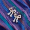 Wolf & Moon Mini Bow Hoops In Cream 1 Wolf & Moon Mini Bow Hoops In Cream -Wolf & Moon mini bow hoops cream lifestyle 4