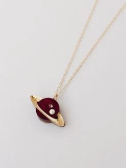 Wolf & Moon Saturn Necklace In Cherry -Wolf & Moon saturn necklace side